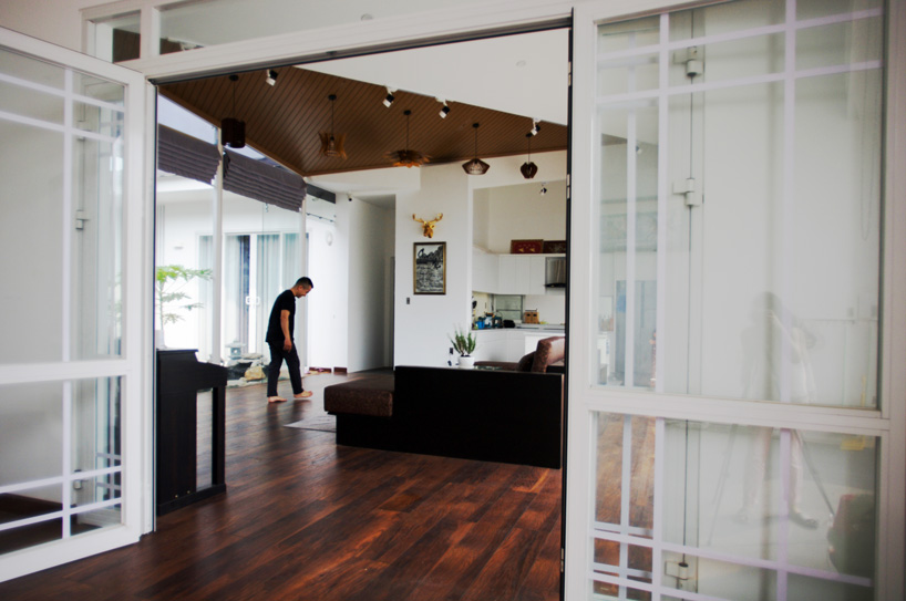 U-shaped residence by atelier NgNg references traditional vietnamese garden houses