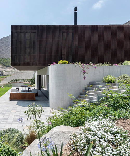 casa topo by martín dulanto is a semi-buried wood + concrete residence in lima, peru