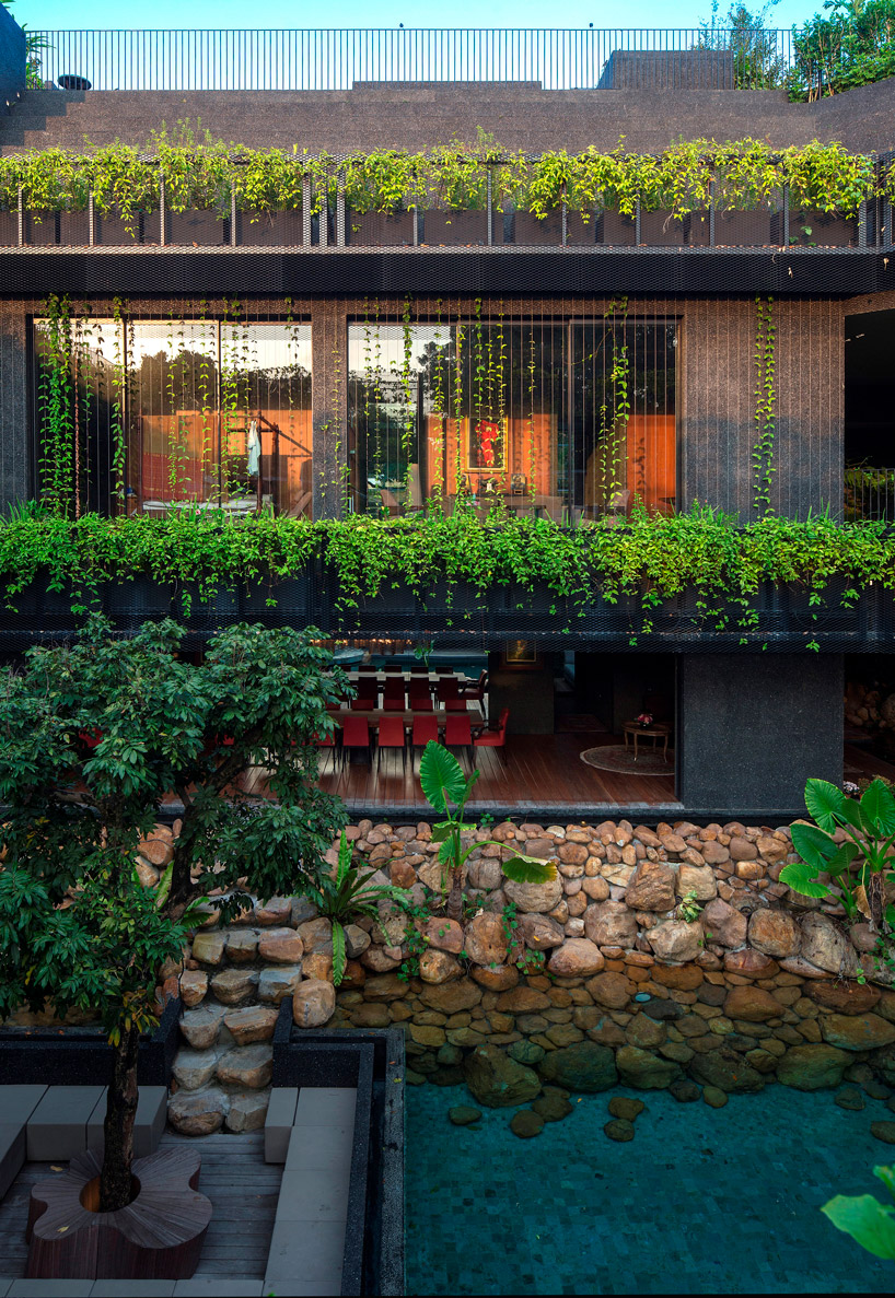 CHANG architects creates stepped garden on the roof of a house in singapore