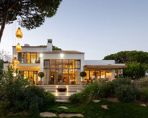 CORE architects uses rustic materials to refurbish beach house in portugal