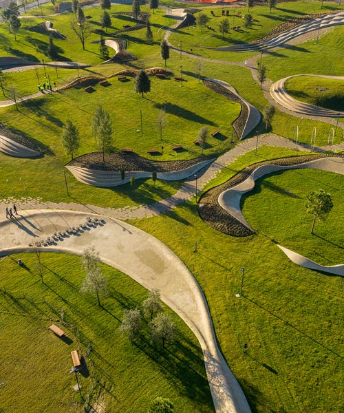 enota uses organically designed urban elements to delineate waterfront park in slovenia