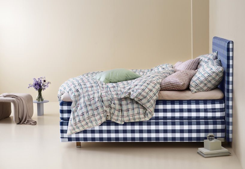 hästens unveils linen collection by lars nilsson under a sky of paper cut flowers