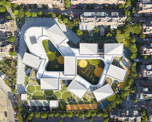 kindergarten complex in shanghai by office mass is shaped like the infinity symbol