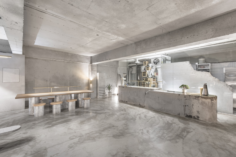 jeonghwa seo crafts brutalist concrete interior for etcetera cafe in seoul
