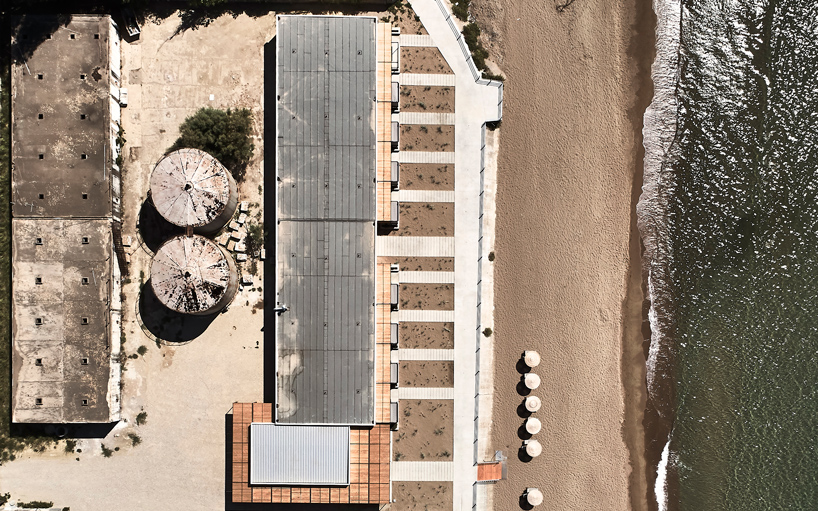 k-studio transforms derelict wine factory into hotel on the coast of greece