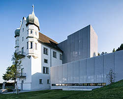 marte marte architects covers austria's castle extensions with translucent aluminum mesh