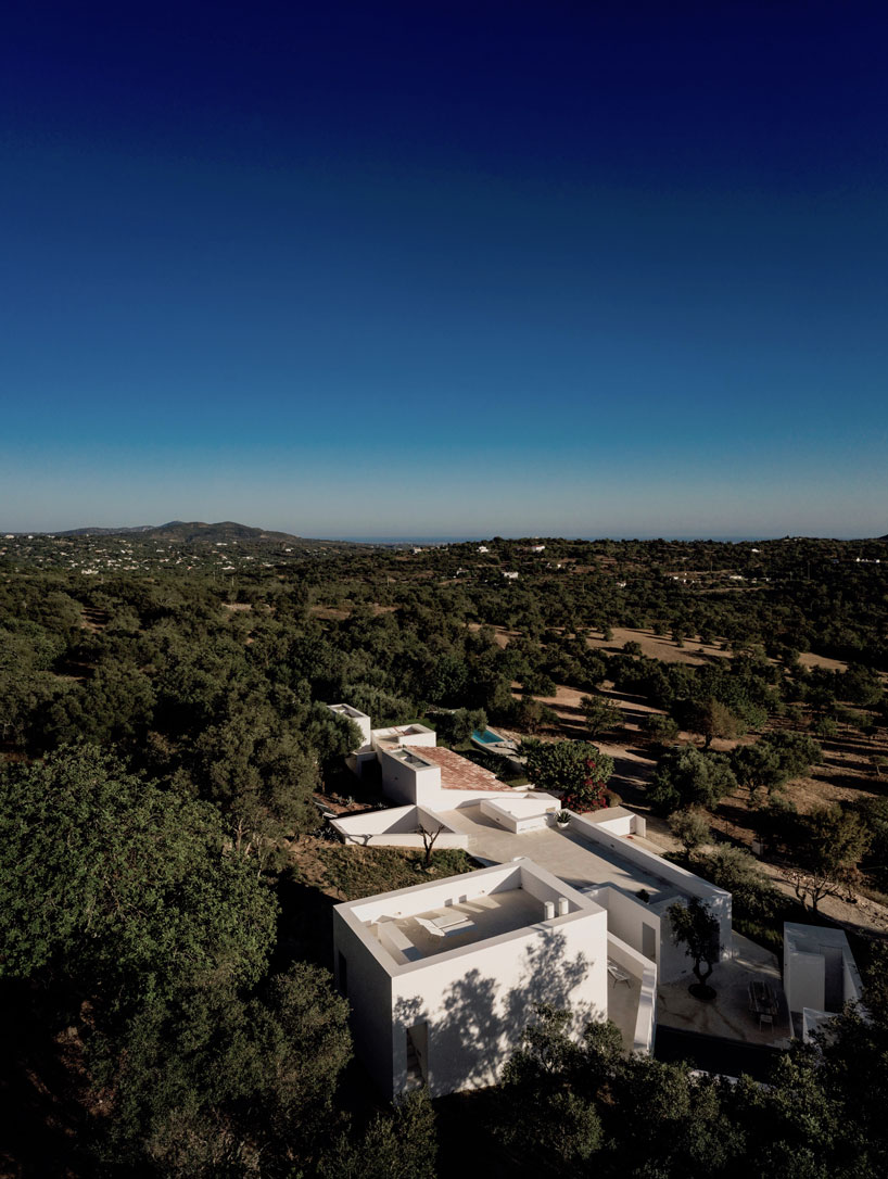 the minimalist casa luum villa by pedro domingos embraces local topography