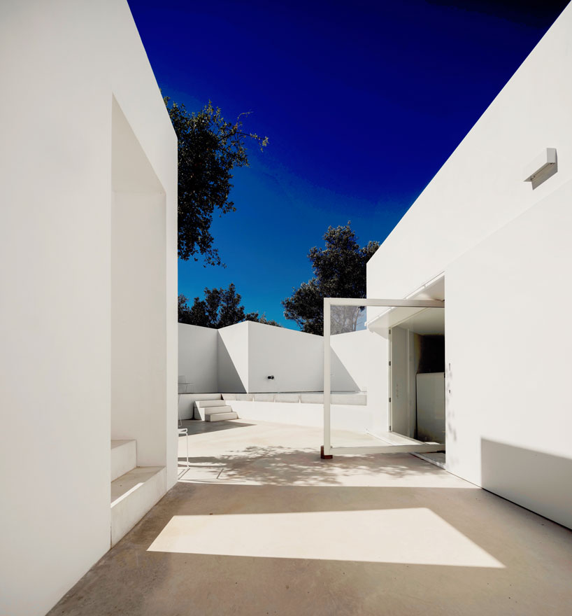 the minimalist casa luum villa by pedro domingos embraces local topography