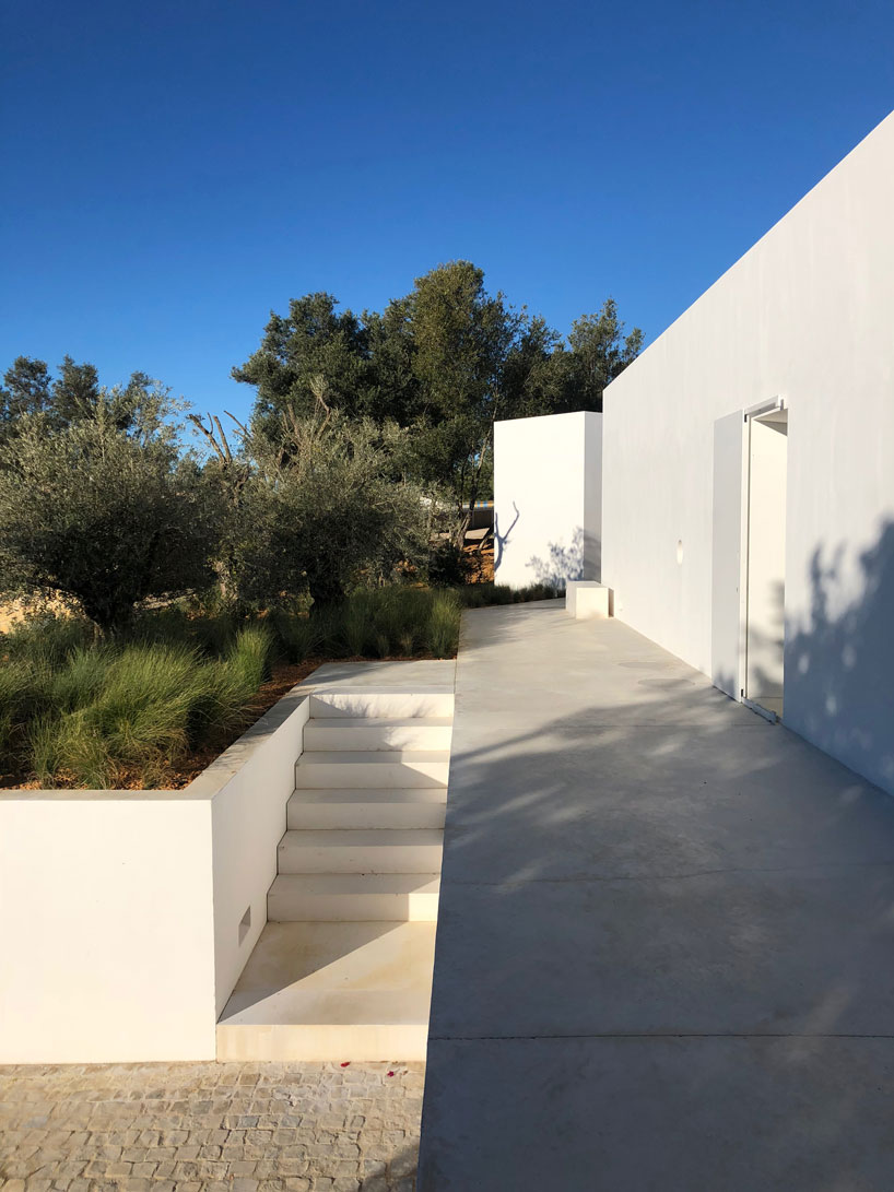 the minimalist casa luum villa by pedro domingos embraces local topography
