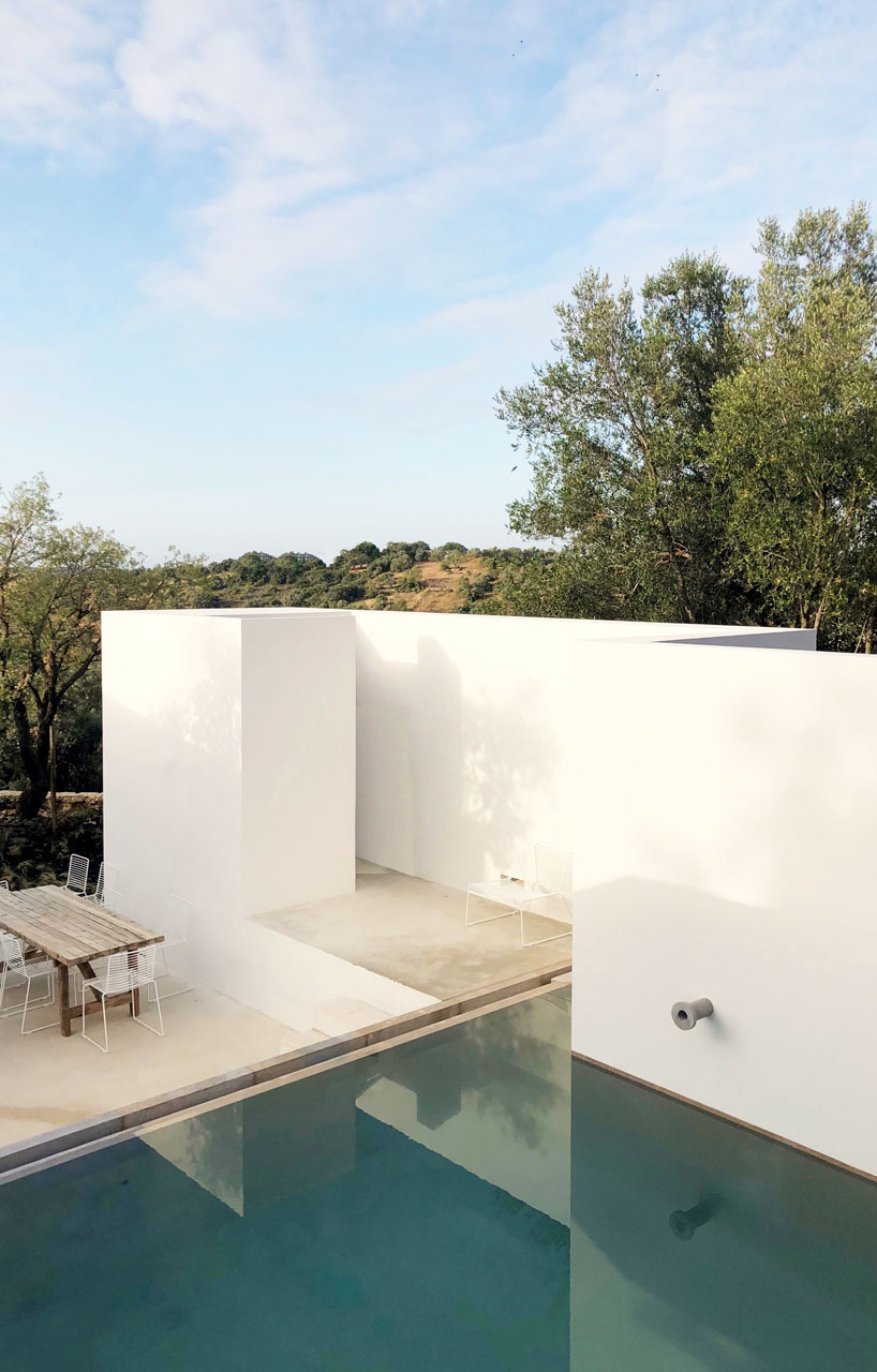 the minimalist casa luum villa by pedro domingos embraces local topography