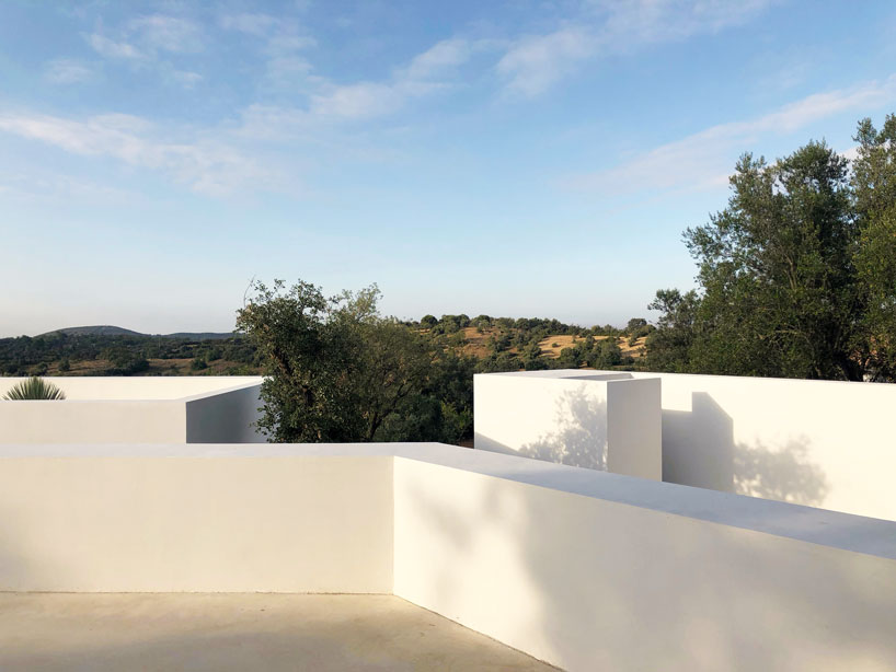 the minimalist casa luum villa by pedro domingos embraces local topography