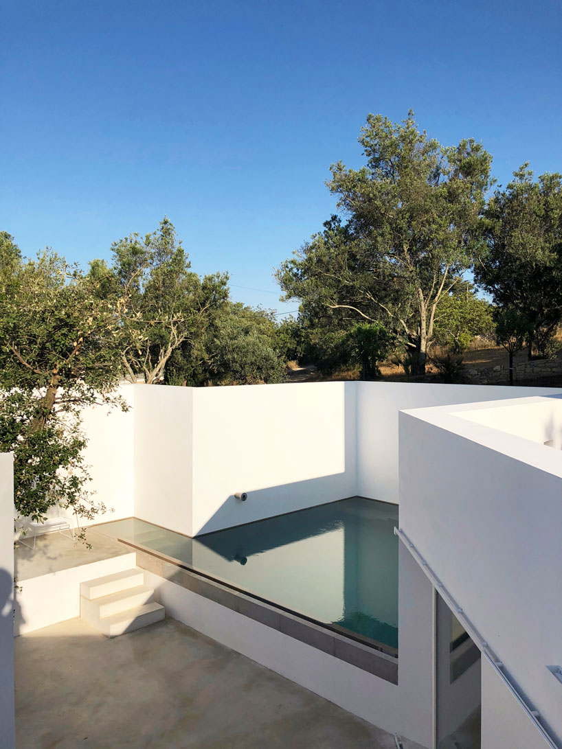 the minimalist casa luum villa by pedro domingos embraces local topography