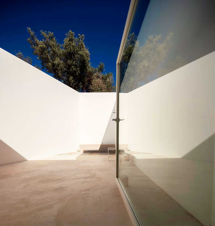 the minimalist casa luum villa by pedro domingos embraces local topography