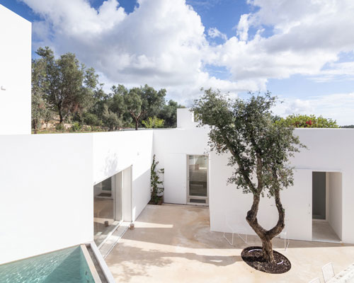 the minimalist casa luum villa by pedro domingos embraces local topography