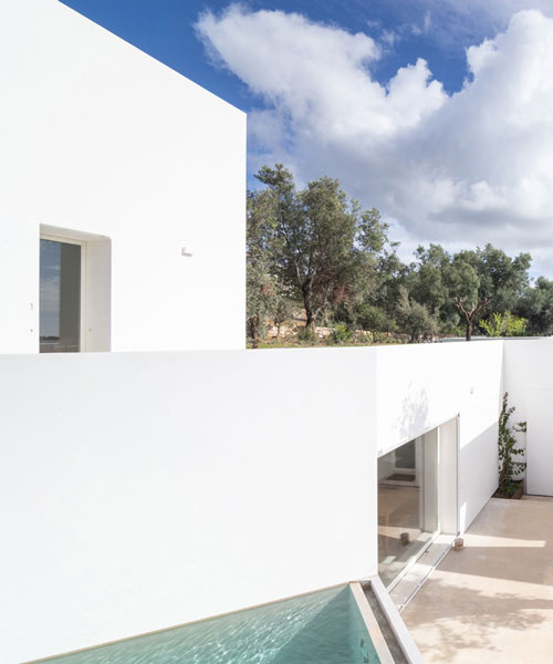 the minimalist casa luum villa by pedro domingos embraces local topography