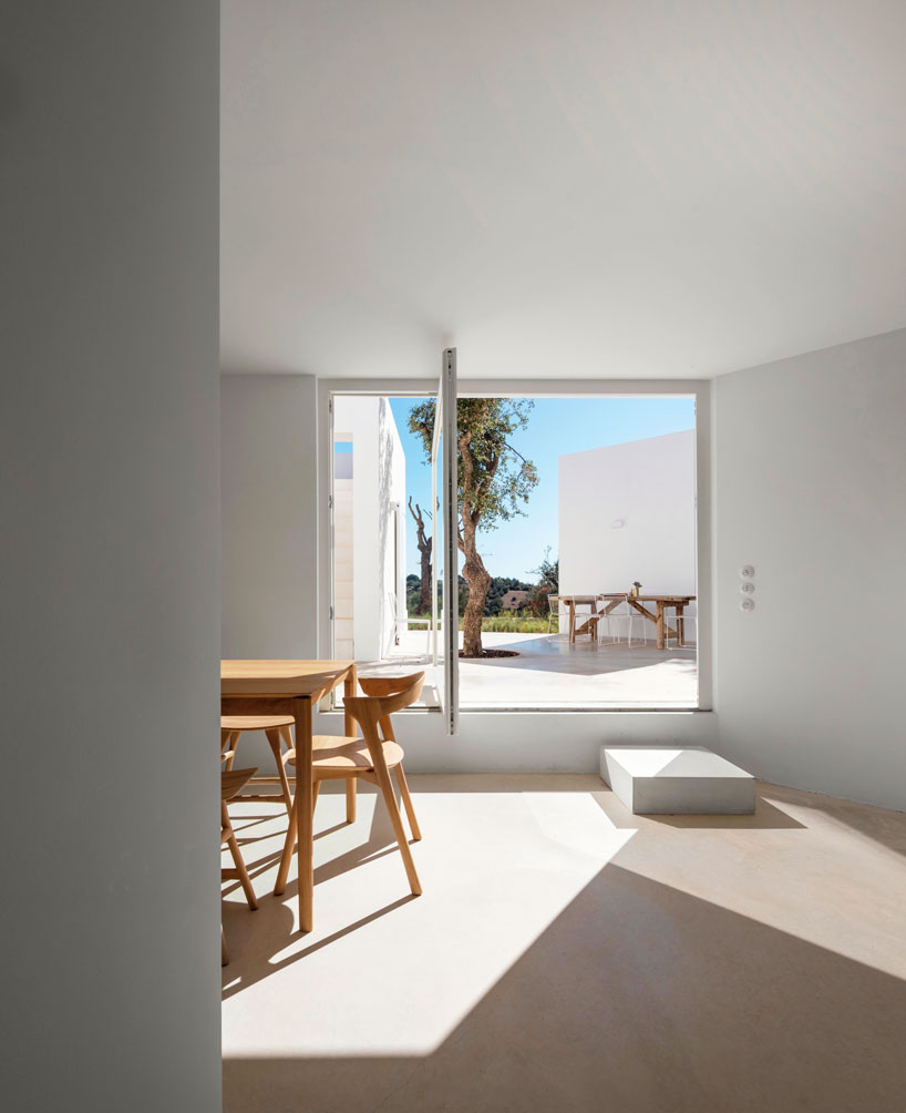the minimalist casa luum villa by pedro domingos embraces local topography