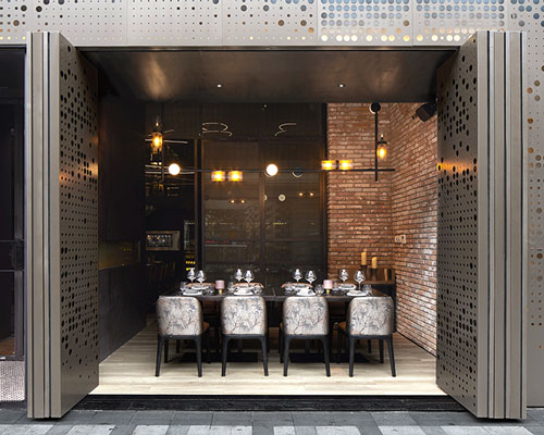 this winery in shanghai features a flexible façade providing both indoor and outdoor experience