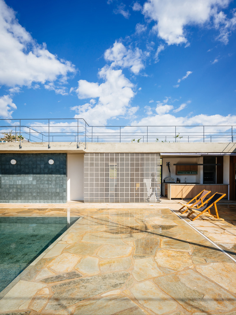 casa joão de barro by terra e tuma emerges from a sloping site in itatiba, brazil