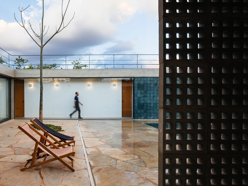 casa joão de barro by terra e tuma emerges from a sloping site in itatiba, brazil
