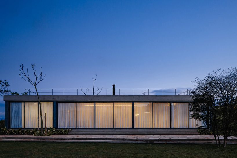 casa joão de barro by terra e tuma emerges from a sloping site in itatiba, brazil