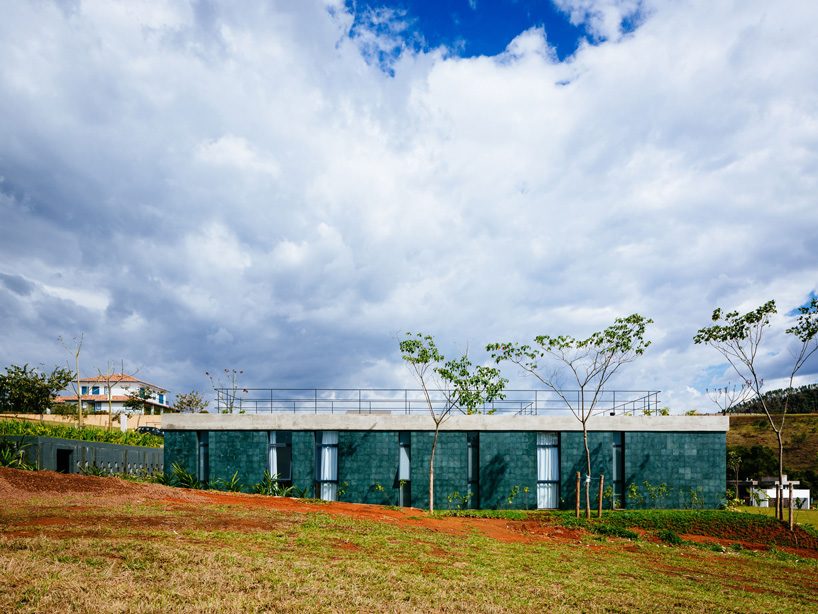 casa joão de barro by terra e tuma emerges from a sloping site in itatiba, brazil
