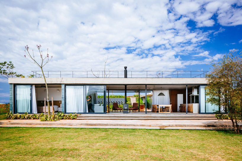 casa joão de barro by terra e tuma emerges from a sloping site in itatiba, brazil