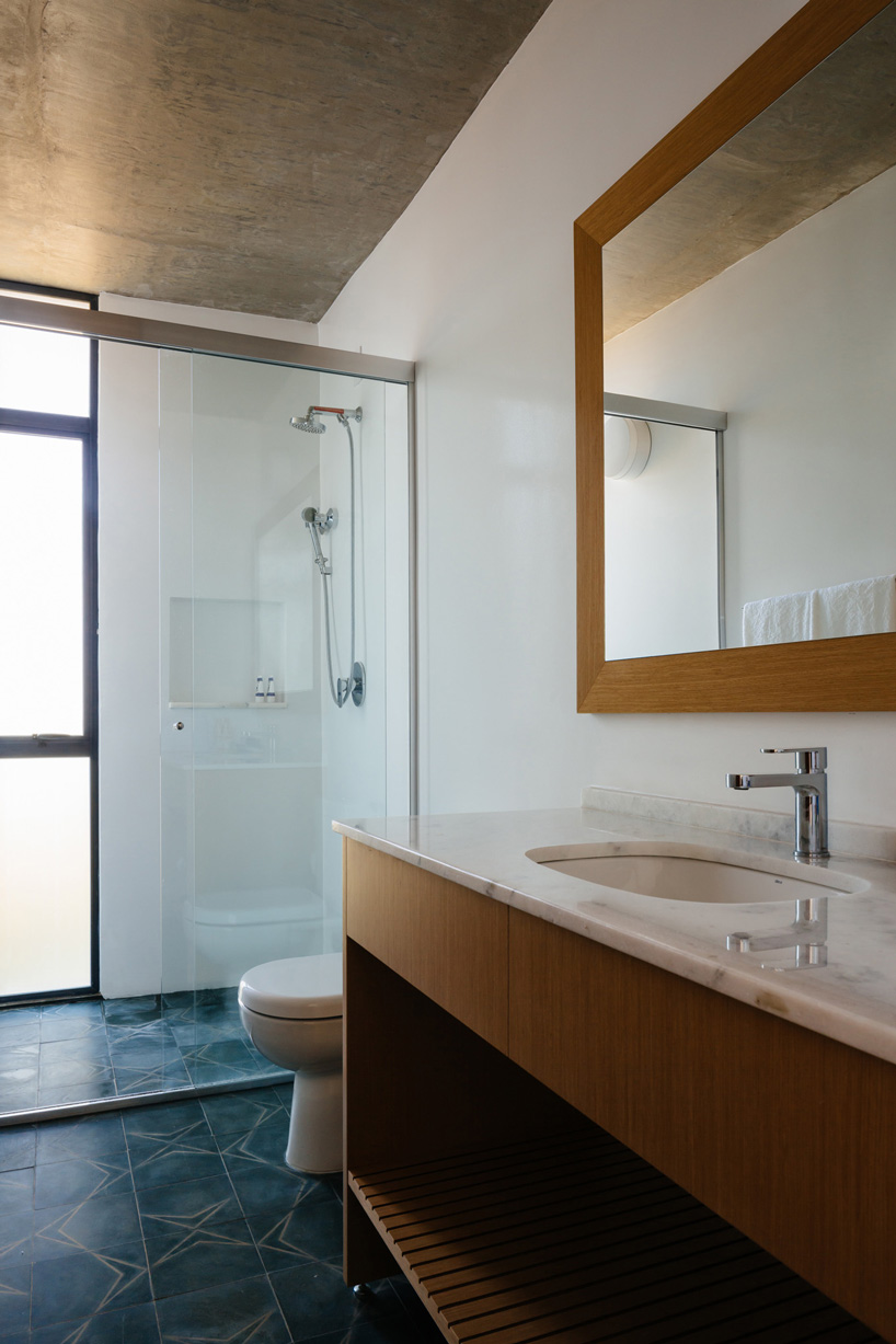 casa joão de barro by terra e tuma emerges from a sloping site in itatiba, brazil