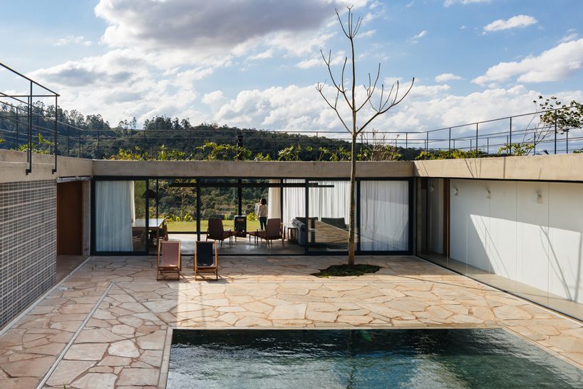 casa joão de barro by terra e tuma emerges from a sloping site in itatiba, brazil
