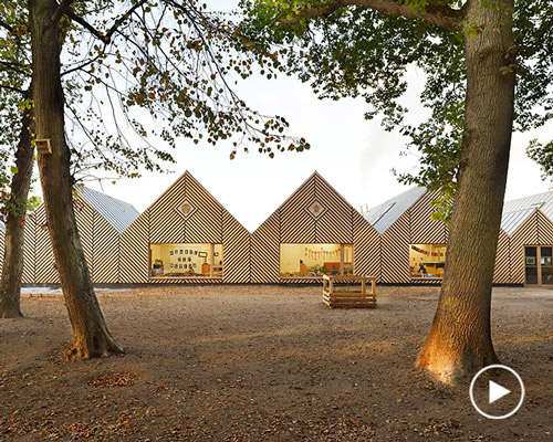 this school in perthes-en-gâtinais comprises multiple gabled wooden volumes
