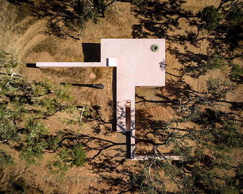 the minimalist cottage house is embedded into the landscape of southern portugal
