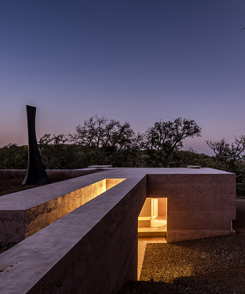 the minimalist cottage house is embedded into the landscape of southern portugal