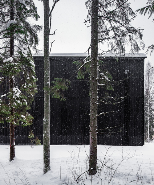 avanto architects constructs all-black barrel storage building for a finnish distillery