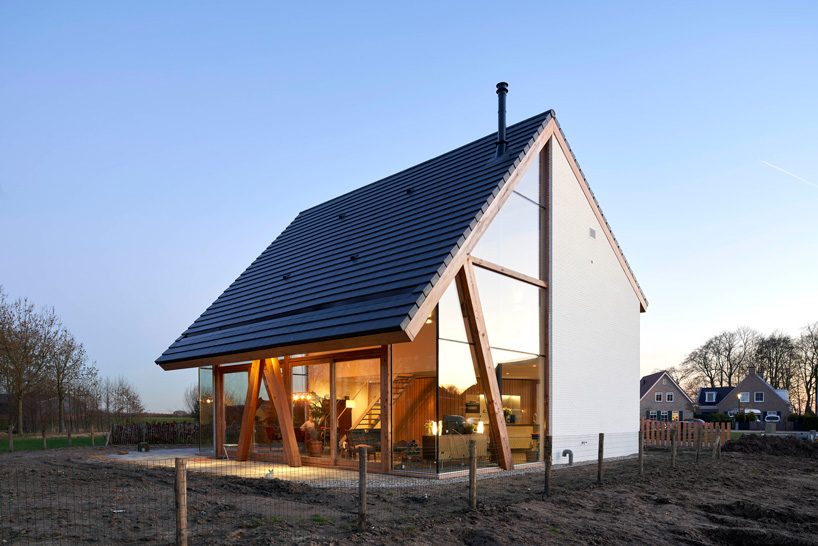 RV architecture completes gabled-roof wooden barnhouse in 