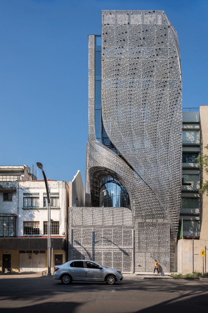 Aluminium strips curve through Mexico City building by Belzberg