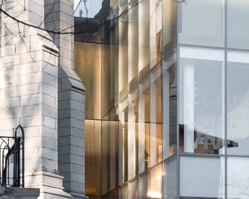 chevalier morales adds glass + perforated brass annex to québec's maison de la littérature