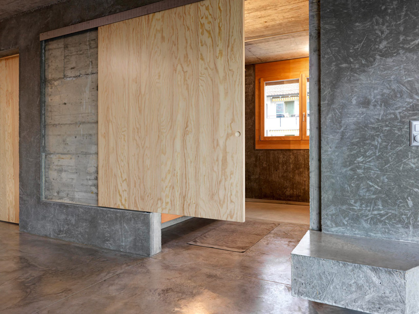 gus wüstemann architects' low-cost concrete housing block in zurich surburb