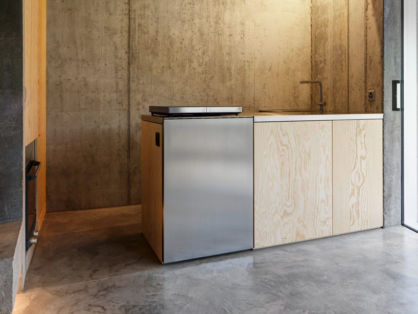 gus wüstemann architects' low-cost concrete housing block in zurich surburb