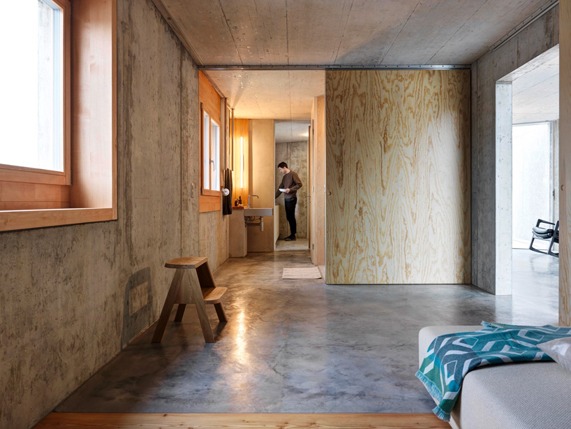 gus wüstemann architects' low-cost concrete housing block in zurich surburb