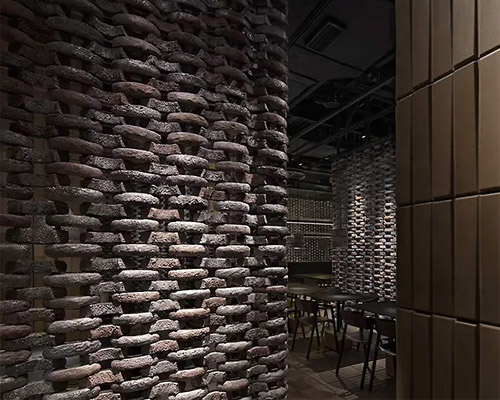 infinity nide brings the tradition of black chinese earthenware into restaurant interior