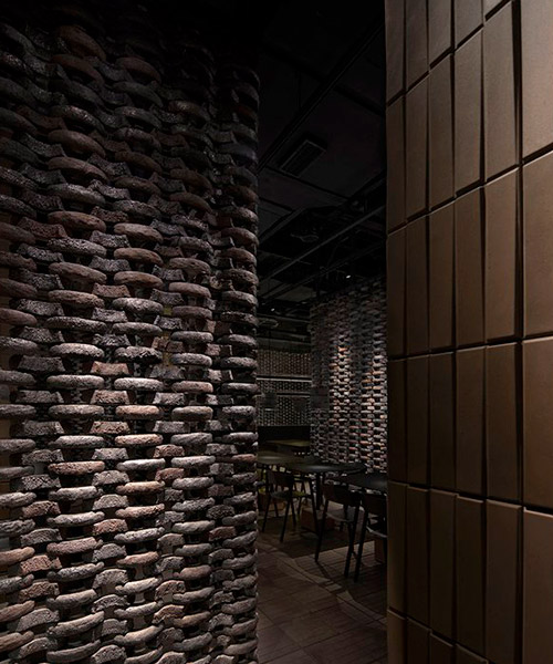 infinity nide brings the tradition of black chinese earthenware into restaurant interior