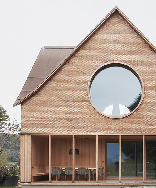the 'house with three eyes' overlooks the mountains of austria's rhine valley