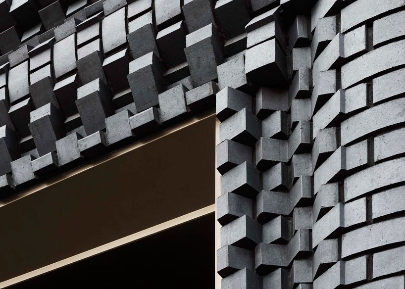 bureau de change architects clads london building in matte blue brick façade