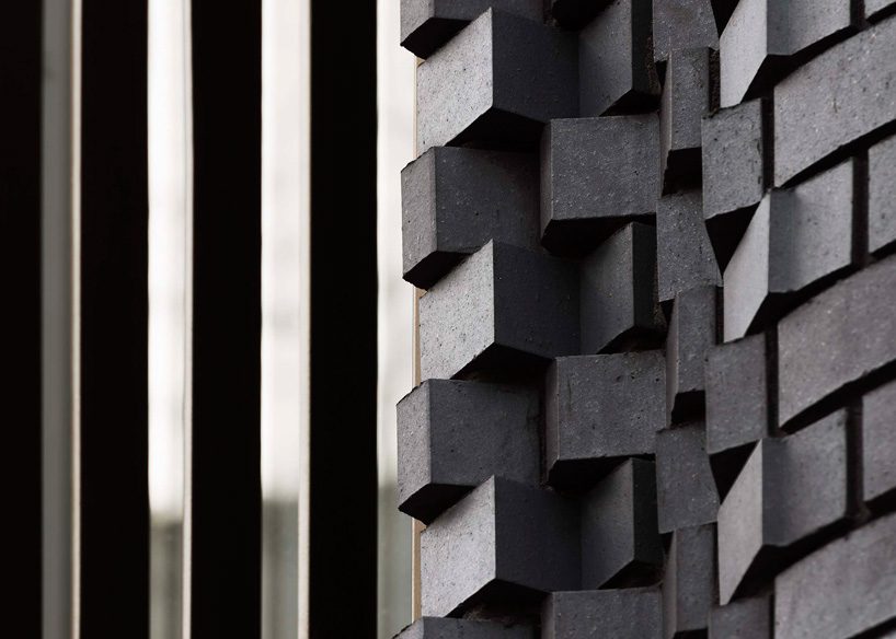 bureau de change architects clads london building in matte blue brick façade