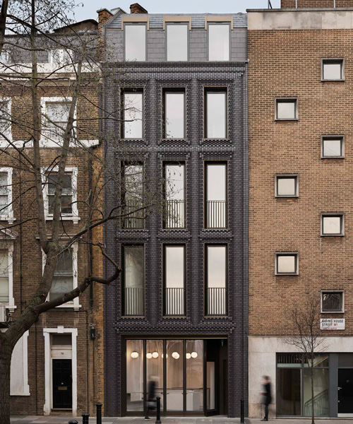 bureau de change architects clads london building in matte blue brick façade