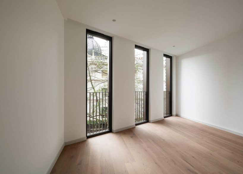 bureau de change architects clads london building in matte blue brick façade