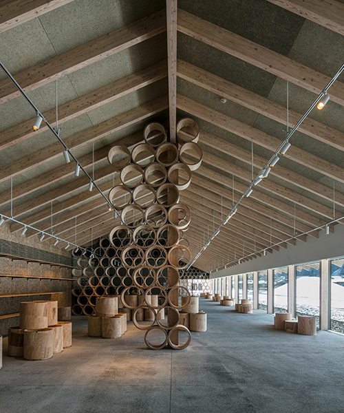 kengo kuma integrates natural hot springs into the oyu road station of kazuno city