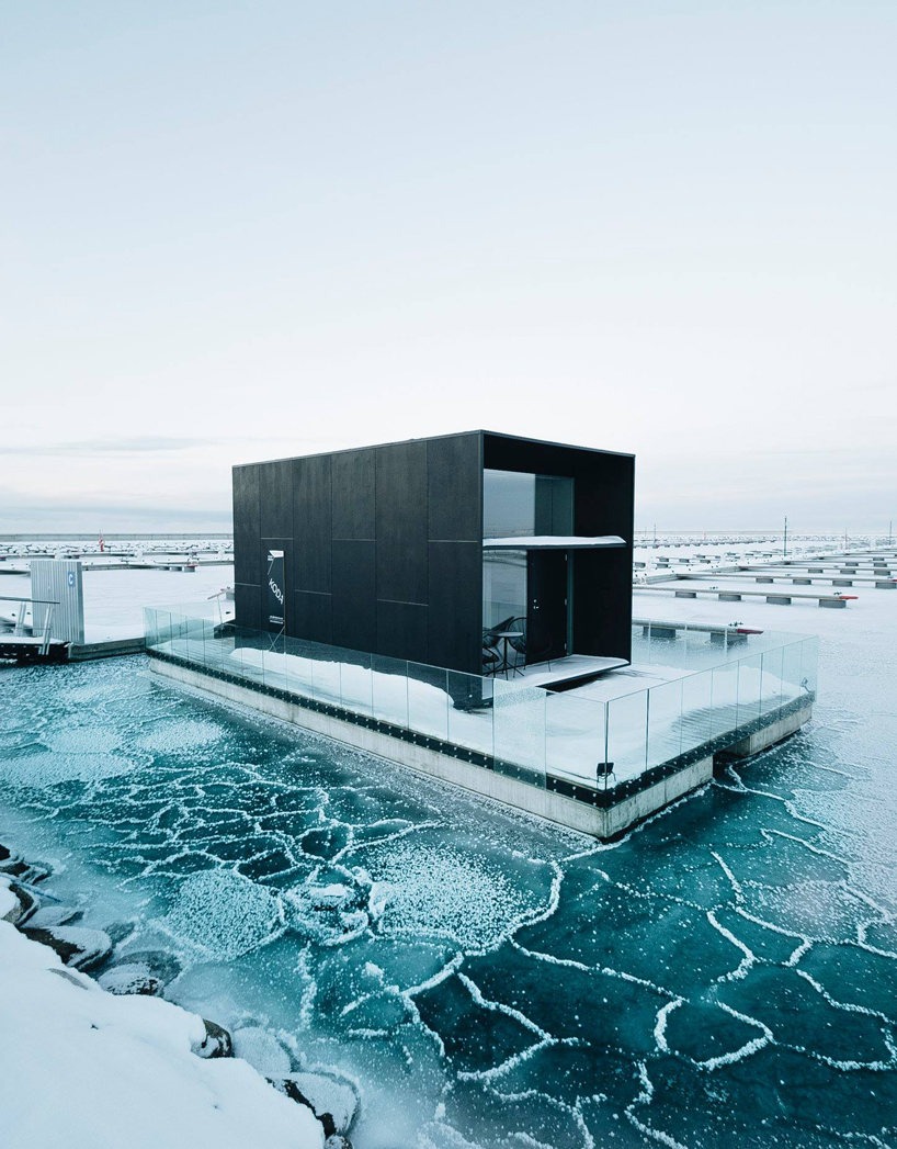 kodasema's tiny prefab house floats on water through integrated pontoons