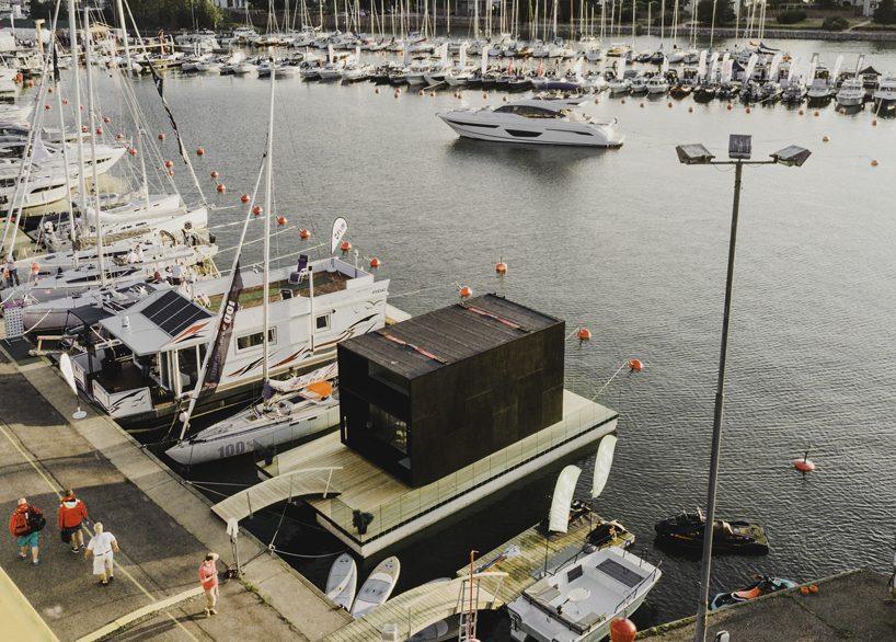 kodasema's tiny prefab house floats on water through integrated pontoons