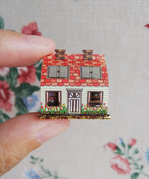 miniature pop-up books hold beds and staircases smaller than fingernails