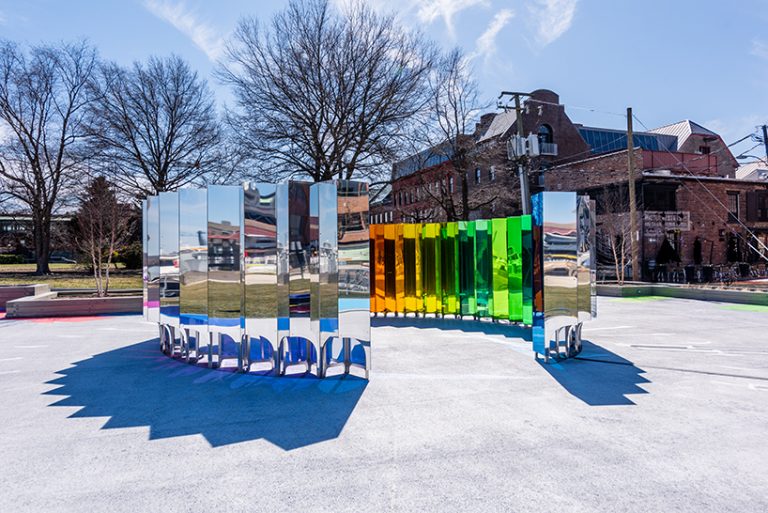 new installation uses old lighthouse tech to beam prisms of colorful light